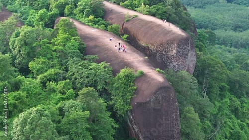 Drone shot of beautiful mountain looks like whale and camera  spinning around  three whale stones.