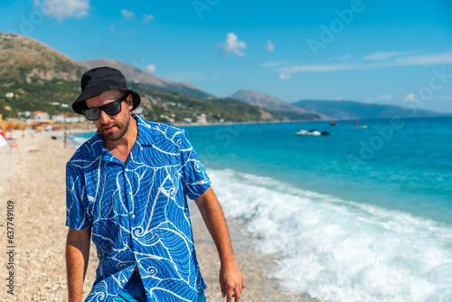 A young tourist walking on the beach of the Albanian riviera called Borsh in Vlore  Albania