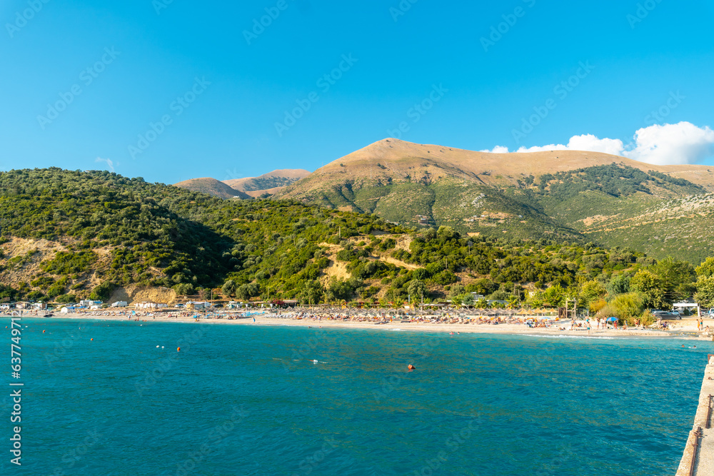 Albanian riviera beach with sunbeds near Vlore in summer vacation, Albania