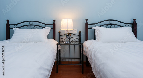 Billede på lærred Two separate beds in a hotel family bedroom