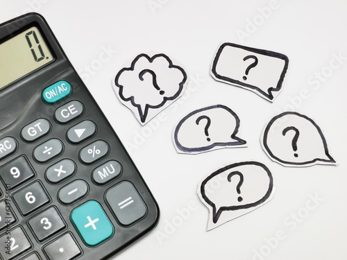 Question mark on bubble speech with calculator.