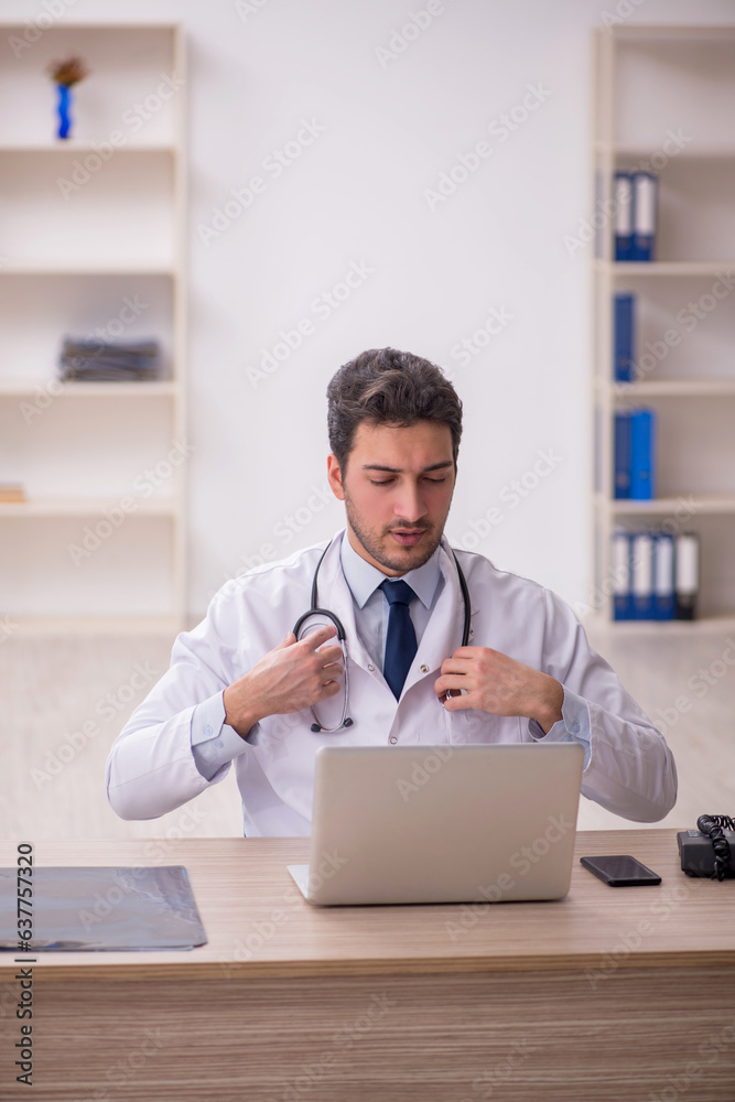 Young male doctor in telemedicine concept
