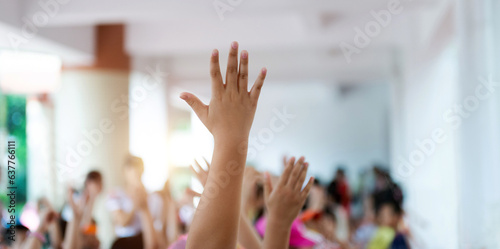 Photos Group of happy children with their hands up