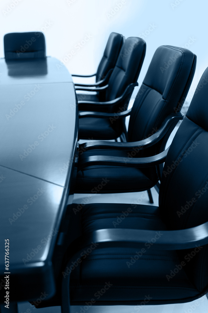 Fototapeta premium Empty meeting room with table and row of chairs