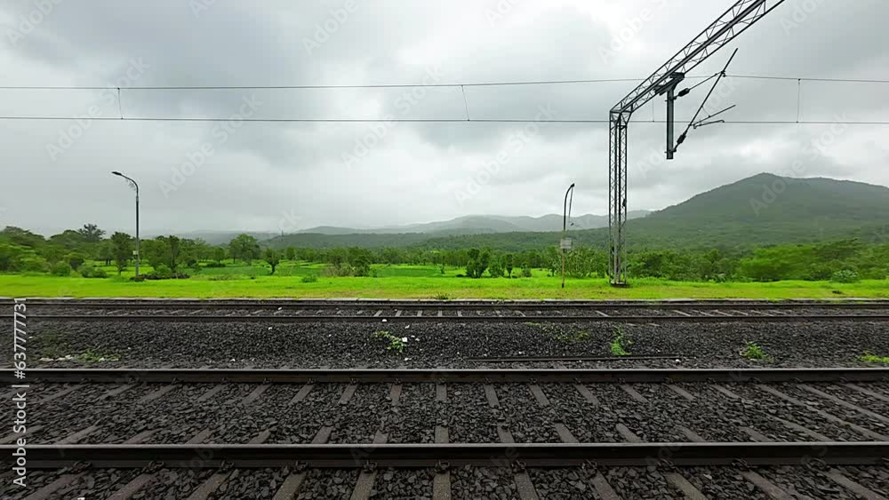 greenery forest timelaps view from train window in Konkan railway.