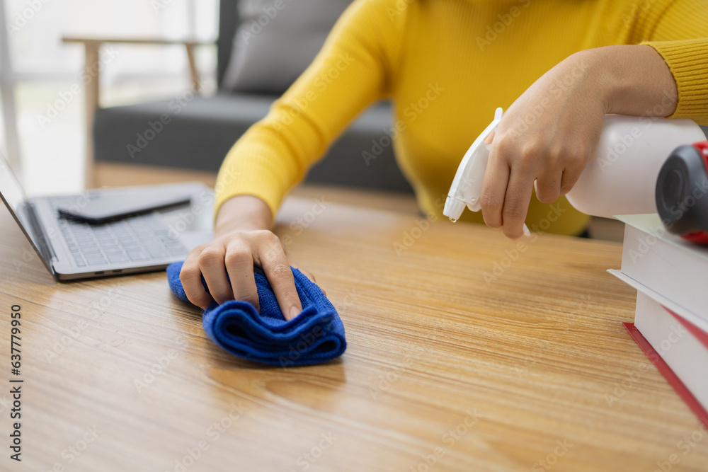 People are using wipes to clean their desks, using cleaners and wipes on their desks, preventing