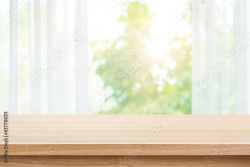 Empty wood table top on blur curtained autumn window background