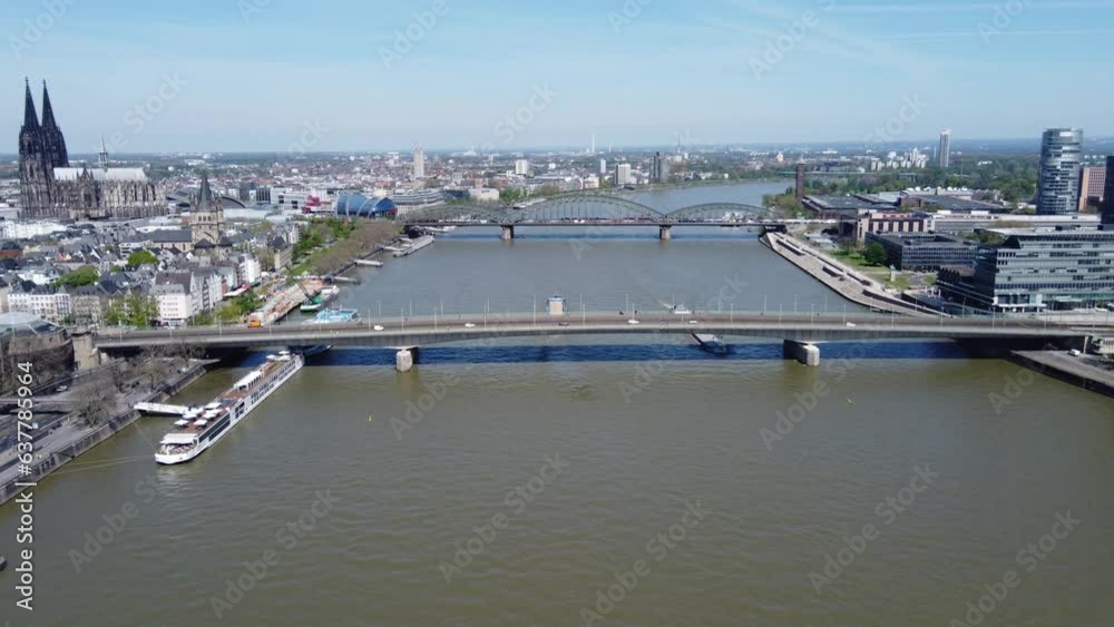 Aerial dolly push in above bridges crossing river in cologne germany Aerial dolly push in above bridges crossing river in cologne germany