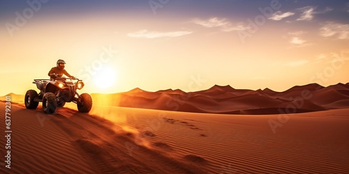 Quad rider in the Desert at sunset  wide screen orientation