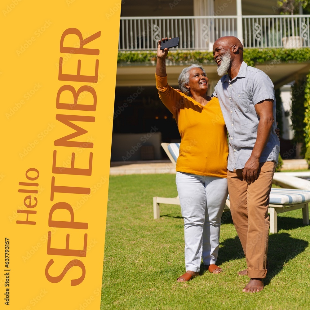 Fototapeta premium Composite of hello september text over senior african american couple taking selfie in garden