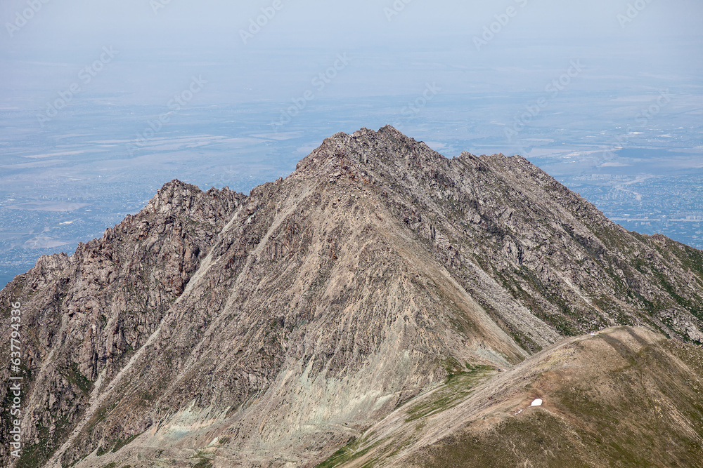 The majestic Big Almaty Peak rises above the vast metropolis