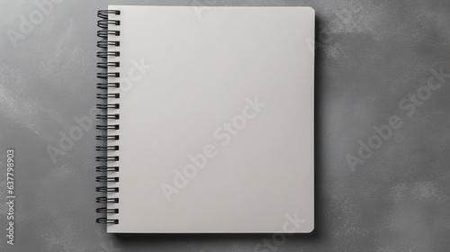 Gray table with mockup of school notebook spiral notepad Empty space
