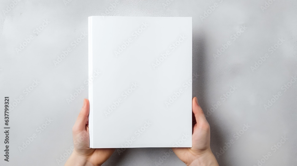 High quality photo of a blank white book mockup in hand on a gray banner background