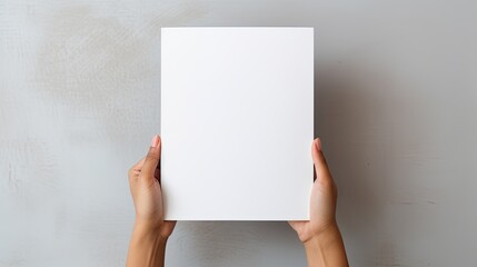 Female hands holding blank magazine gray background design template. Mockup image