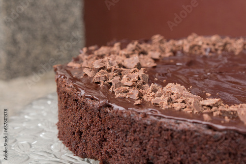 Close up of a delicious looking dark chocolate cake with icing