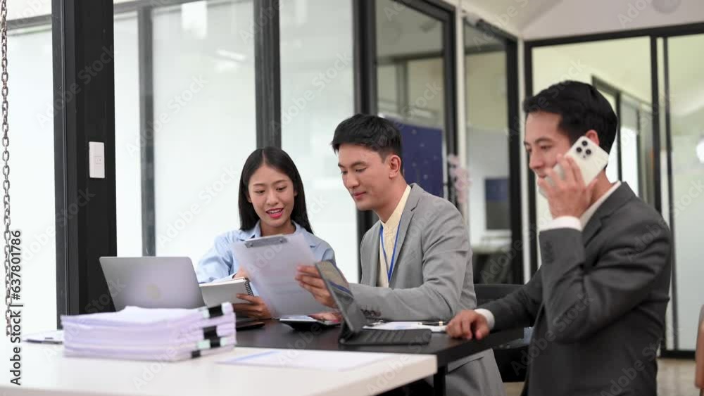 Business team discuss at meeting room. working together with laptop ,tablet and smart phone on desk Financial accountant , planner, meeting , introduction concept. Business team discuss at meeting room. working together with laptop ,tablet and smart phone on desk Financial accountant , planner, meeting , introduction concept.
