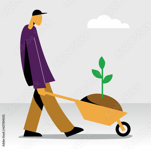 man with wheelbarrow carrying a tree sapling