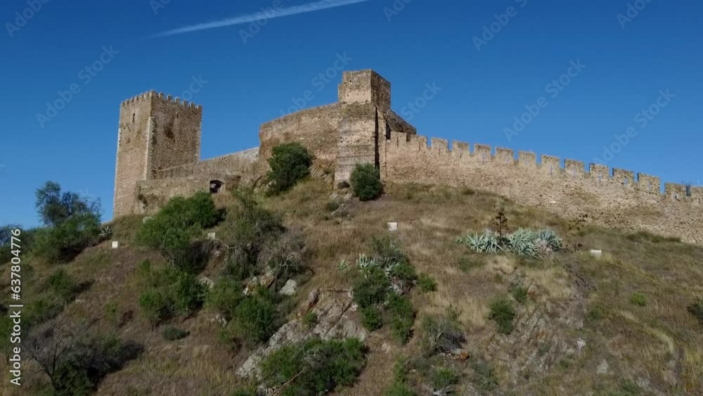 Slow Motion Aerial View of Alentejo - Portugal: Aerial Odyssey - Soaring Over Mertola Castle on a Dreamy Summer Day Slow Motion Aerial View of Alentejo - Portugal: Aerial Odyssey - Soaring Over Mertola Castle on a Dreamy Summer Day