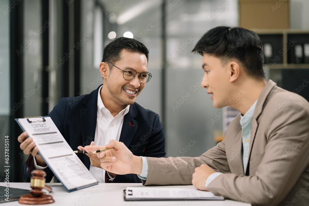 Business people and lawyers discussing contract papers sitting in the table at office in the morning. concepts of law, advice, legal services.