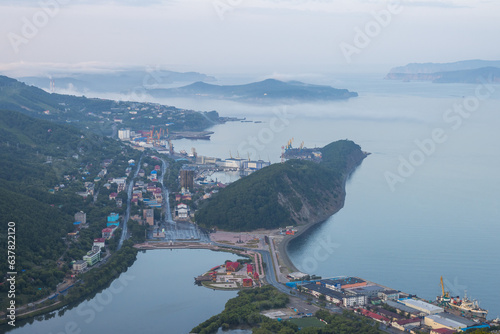 View from Mishennaya Sopka to the port city of Petropavlovsk-Kamchatsky, located on the coast of the Avacha Bay of the Pacific Ocean. Kamchatka, Far East of Russia. Top view of buildings and streets. photo