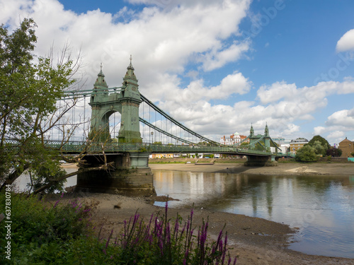 Photography Hammersmith Bridge viewed from the south bank of the River Thames in West London