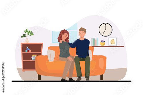 Man siting indoor and supporting his upset wife