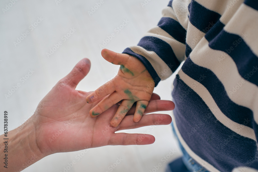 Little boy showing dirty hand