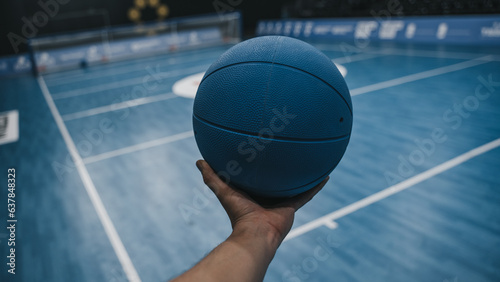 Goalball on court in hand