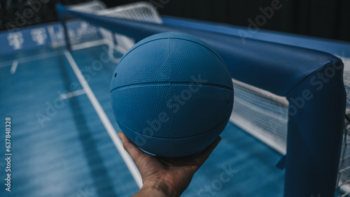 Goalball next to net in hand