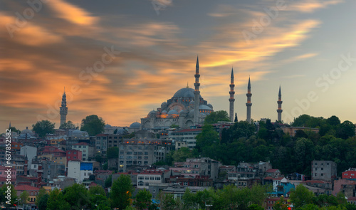 Beautiful view of gorgeous historical Suleymaniye Mosque, Rustem Pasa Mosque and buildings in front of dramatic sunset. Istanbul most popular tourism destination of Turkey