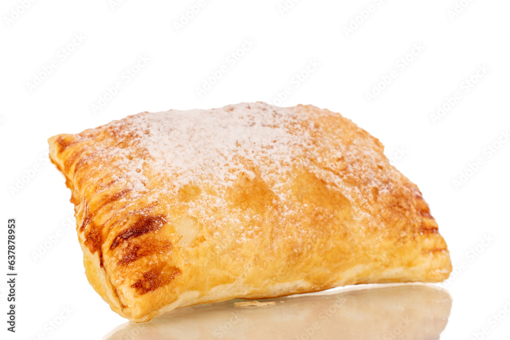 One aromatic puff pastry bun with apples, macro, isolated on white background. One aromatic puff pastry bun with apples, macro, isolated on white background.