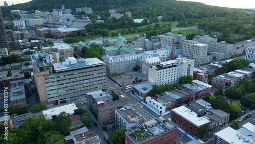 Aerial shot drone flies toward McGill University and Mount Royal in downtown Montreal photo