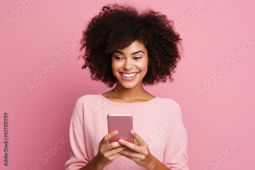 woman with phone on pink background. .