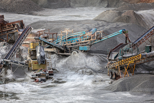 High angle view of heavy machinery working in quarry photo