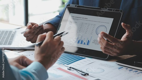 Financial Business team present. Business man hands hold documents with financial statistic stock photo, discussion, and analysis report data the charts and graphs. Finance Financial concept