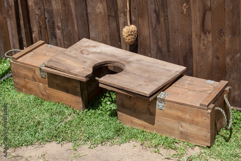 Latrine plank placed over two camp wooden boxes Latrine plank placed over two camp wooden boxes