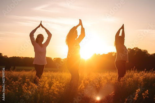 A group practicing Tai Chi in perfect harmony, their movements complemented by the calming ambiance of the setting sun. Generative AI #637899736