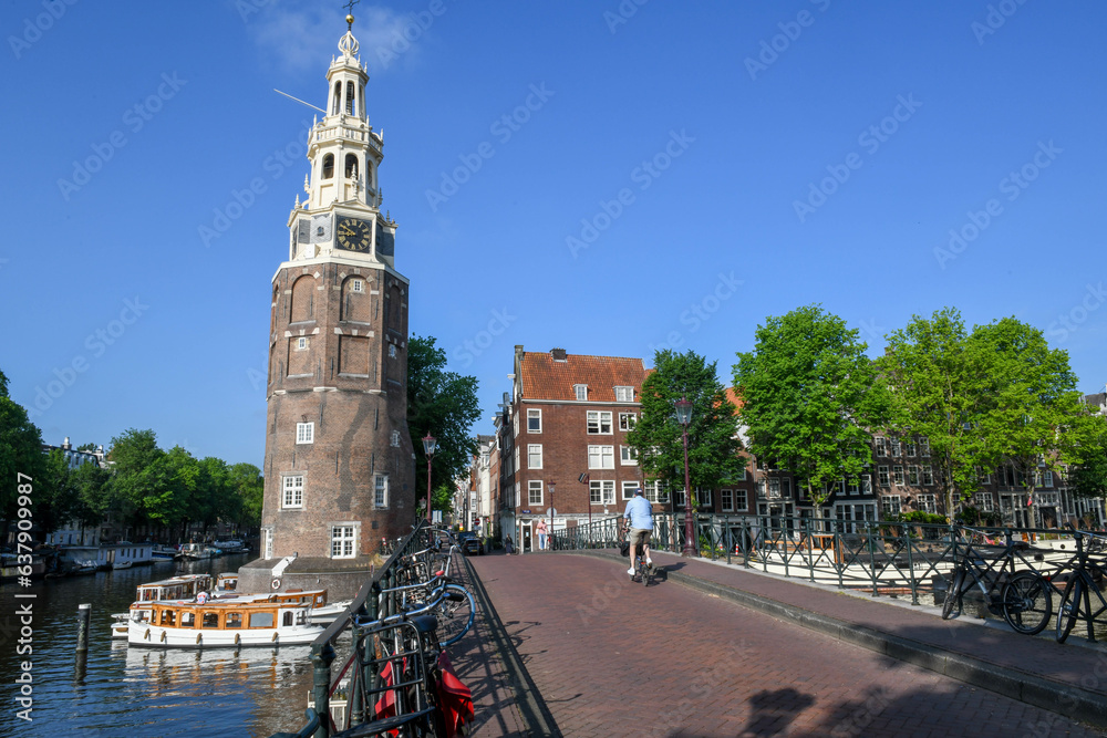 Montelbaanstoren tower at a channel in the center of Amsterdam on Holland
