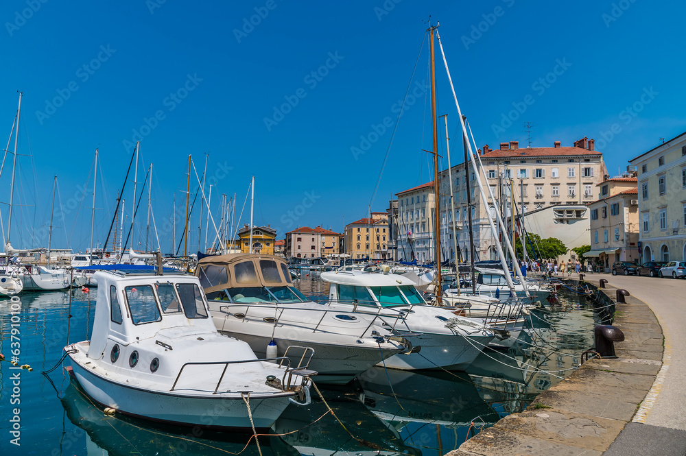 A view of boats moored in the marina in the town of Piran, Slovenia in summertime