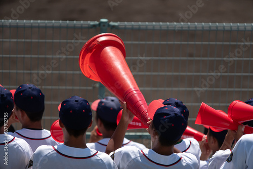 赤いメガホンで応援する野球部 photo