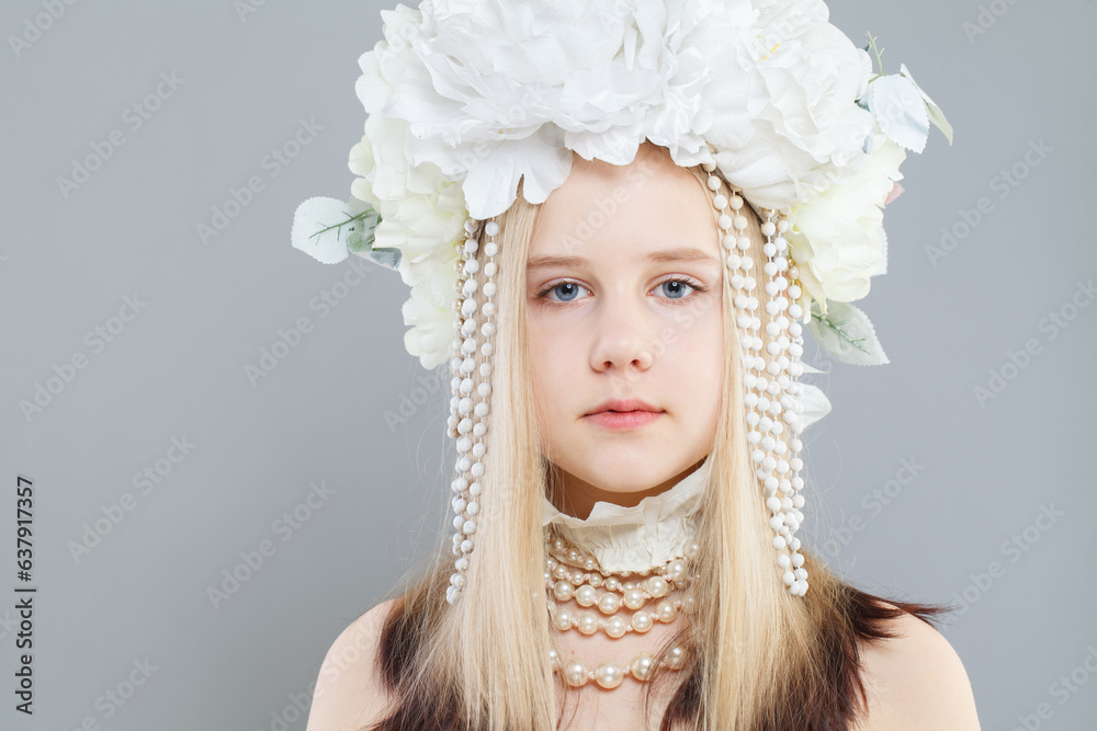 Beautiful young girl wearing white flowers wreath crown, fashion portrait