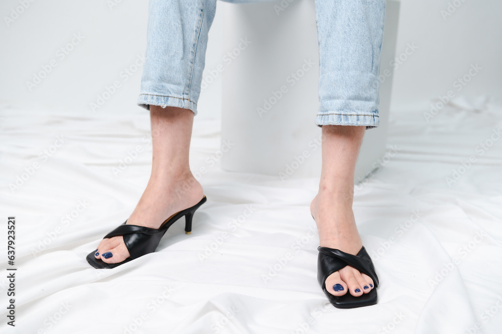 Beautiful woman with stylish shoes on grey background Beautiful woman with stylish shoes on grey background