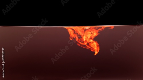Orange colorful fluorescent smoke on black background,Art abstract smoke texture,Colored liquid dye,Splash paint,Abstract color,Abstract Textures	