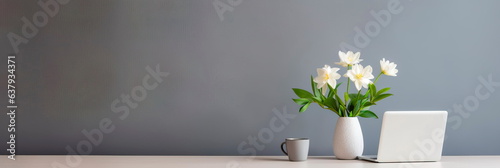 Minimalistic office desk with a laptop and one flower on the table. Generative AI © Лилия Захарчук