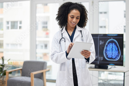 Neurology, doctor and planning surgery with tablet in office with x ray, results and patient data on tech for expert consultation. Cancer, research and black woman to study the brain or neuroscience photo