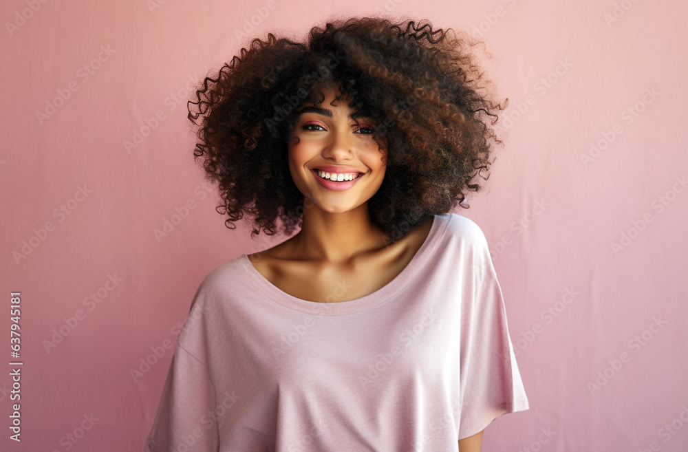 portrait of a curly afro woman with pink clothes.