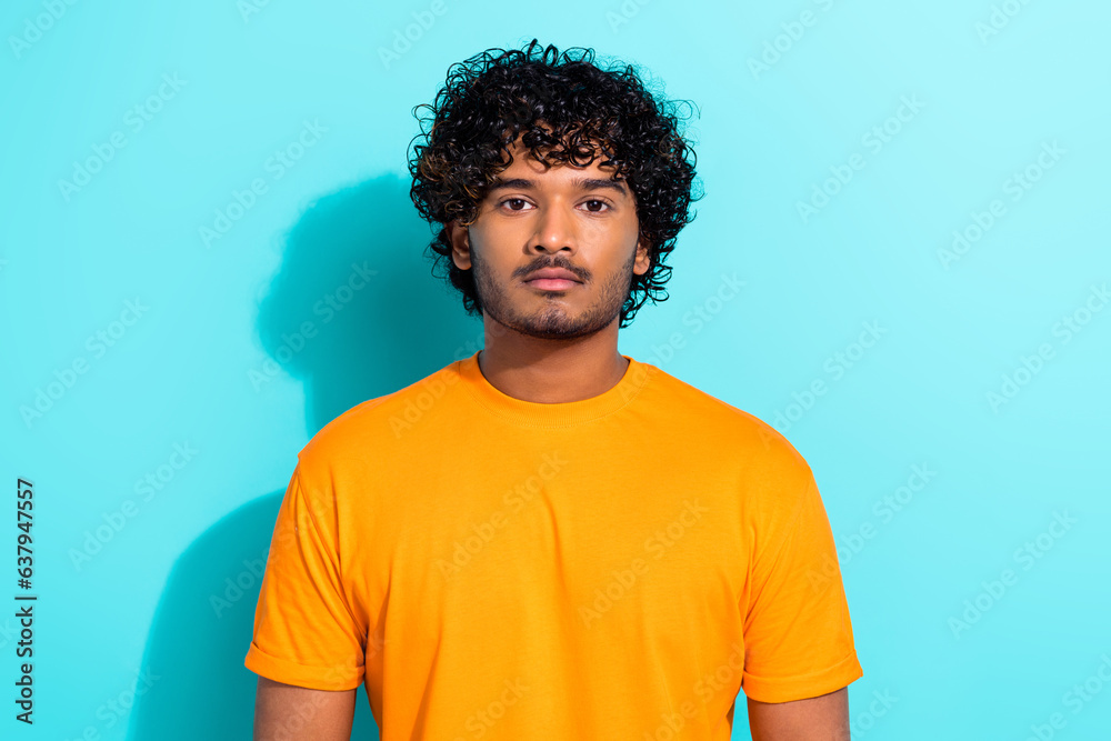 Photo of focused concentrated person calm face curly hairstyle isolated on bright teal color background Photo of focused concentrated person calm face curly hairstyle isolated on bright teal color background