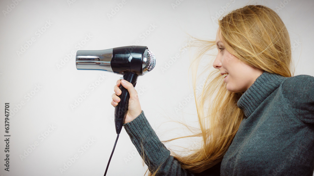 Woman holding hairdryer Woman holding hairdryer