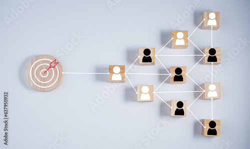 wooden block which prints a target icon connection linkage with human icon on white background. Business goals and objectives concept. business competition. customer focus target group 