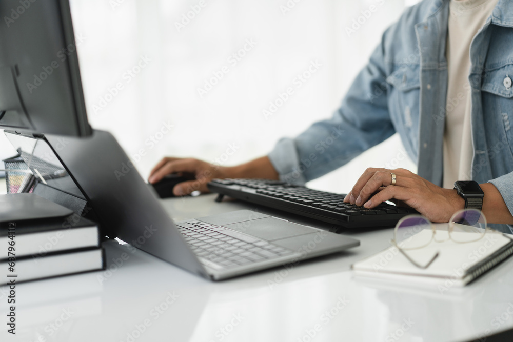 Developer programmer checking code on multiple monitor while programming to developing web and apps Developer programmer checking code on multiple monitor while programming to developing web and apps